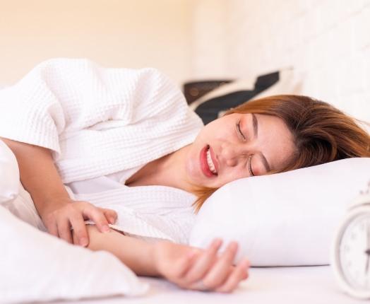 Woman grinding teeth in sleep