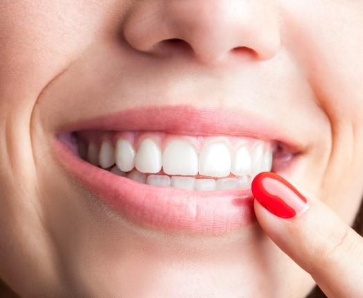 Closeup of healthy smile after gum disease treatment