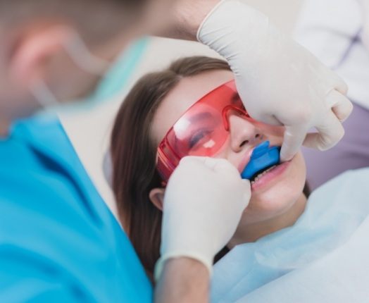 Dental patient receiving fluoride treatment