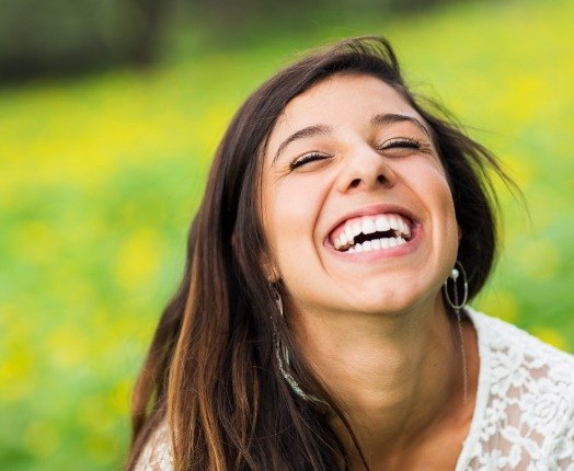 Woman with flawless smile after makeover