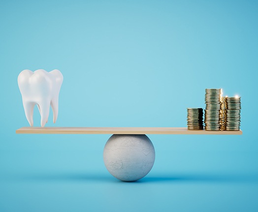 A scale on which a model tooth and stacks of coins are represented