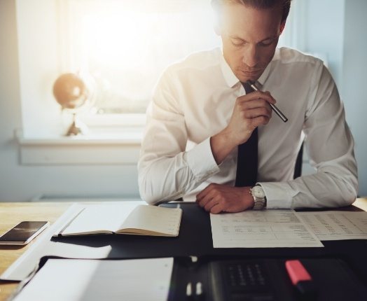 Man reviewing Delta Dental insurance coverage forms