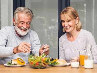 An older couple eating a healthy breakfast