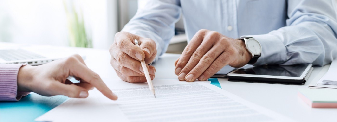 Dentist and dental patient reviewing financing options