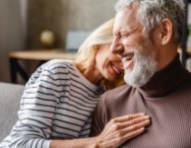 Man and woman smiling after restorative dentistry visit