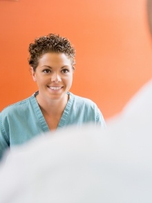 Smiling Harker Heights Texas dental team member talking to dentistry patient