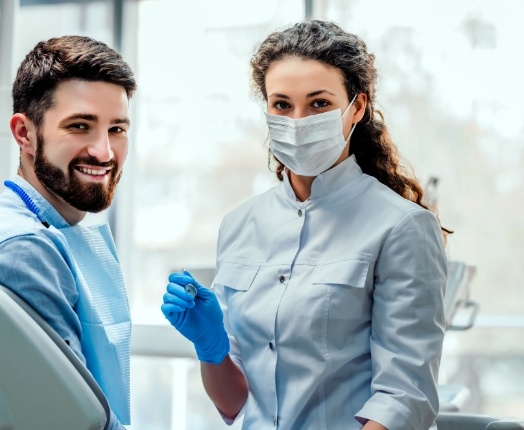 Smiling dentist and dental patient
