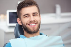 man smiling undergoing dental checkup