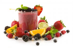 delicious smoothie and assorted fruits