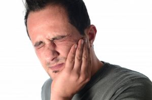 man with toothache needs to visit dentist in Harker Heights