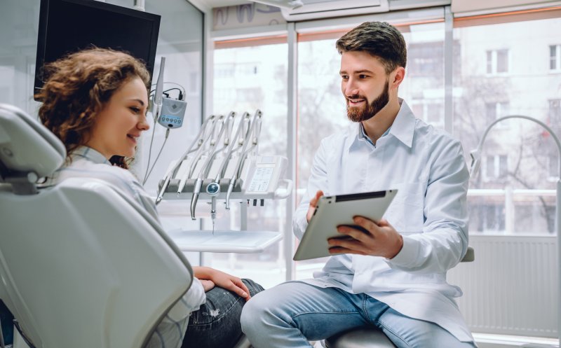 Dentist talking to patient about insurance coverage