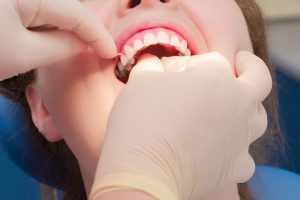 dentist in Harker Heights flossing teeth