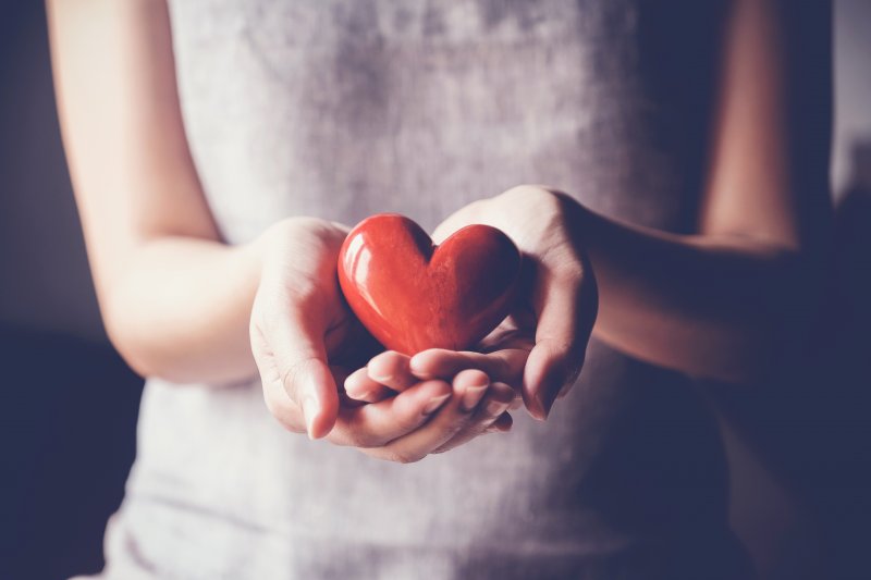 woman showing heart to dentist in Harker Heights