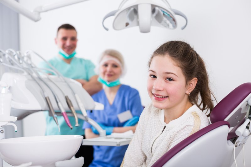 A teen girl about to have a dental exam with a dentist in Harker Heights