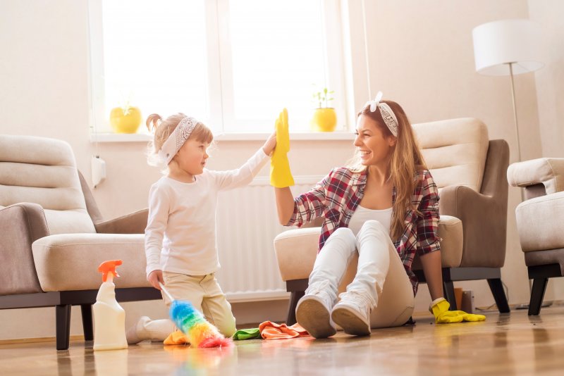 A mother and daughter performing spring cleaning