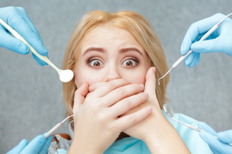 A closeup shot of a frightened dental patient